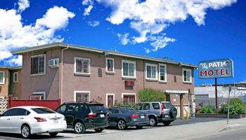 A two-story motel with a sign reading 