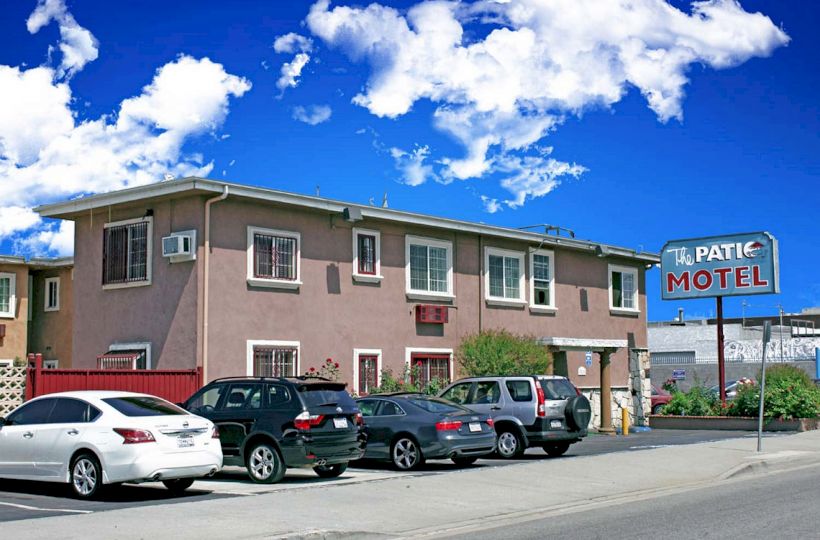 A two-story motel with a sign reading 